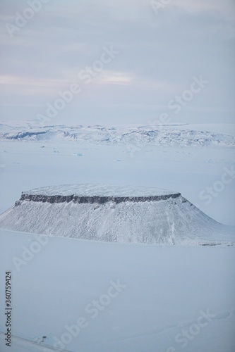 Cuadro en lienzo Aerial shot of the Dundas mountain covered in snow in Thule, Greenland