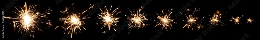 Series of burning sparklers with lots of hot glowing embers exploding and burning away. For New Years or 4th of July celebration.