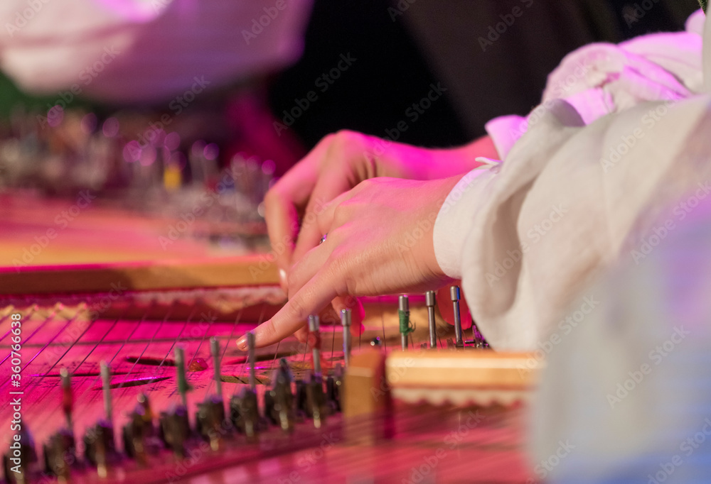 Hand playing on traditional korean zitherlike string instrument, gayageum (kayagum) Stock Photo