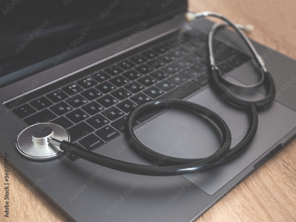Stethoscope keyboard laptop computer isolated on blue background. Modern medical Information technology and sofware advances concept. Computer and gadget diagnostics and repair. Flat lay top view Stethoscope keyboard laptop computer isolated on blue background. Modern medical Information technology and sofware advances concept. Computer and gadget diagnostics and repair. Flat lay top view