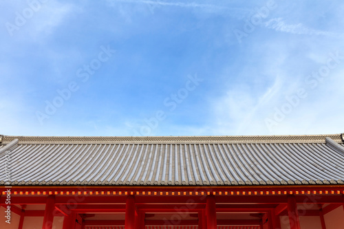 Japanese temple roof against blue sky, Kyoto Imperial Palace, Kyoto, Japan. (Sky space composition for text) © mrpeak