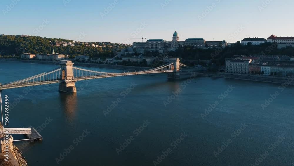 Drone perspective of Szechenyi Chain Bridge at sunrise with Danube river. Budapest,Hungary Drone perspective of Szechenyi Chain Bridge at sunrise with Danube river. Budapest,Hungary
