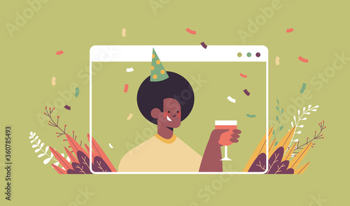 man in funny festive hat celebrating online birthday party african american guy in computer window drinking wine celebration self isolation quarantine concept portrait horizontal vector illustration