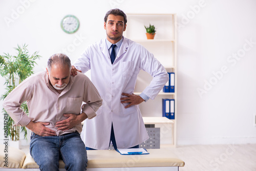 Old patient visiting young male doctor