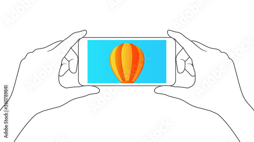 Holding smartphone with both hands. The balloon is displayed on the smartphone screen.