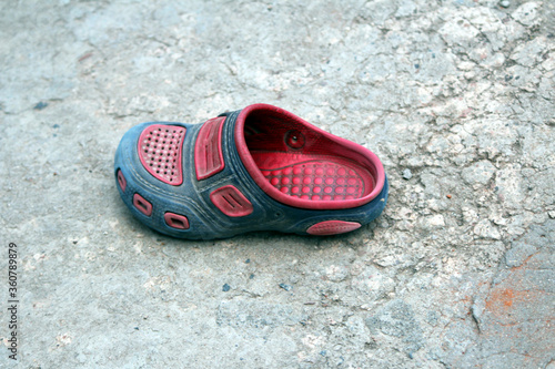 a broken sleeper footwear put on the road
