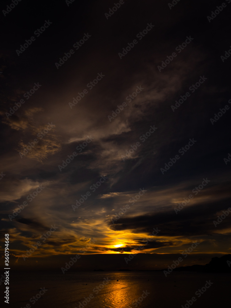 Sunset time above the ocean, water surface at sunset time