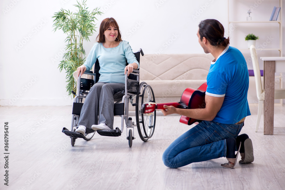 Disabled wife and young husband at home Disabled wife and young husband at home