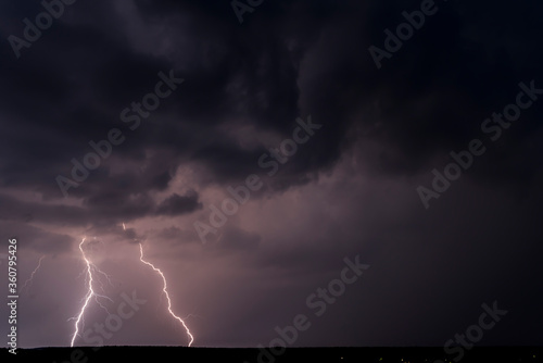 Lightnings in Summer Storm with Dramatic Clouds