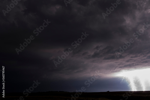 Lightnings in Summer Storm with Dramatic Clouds