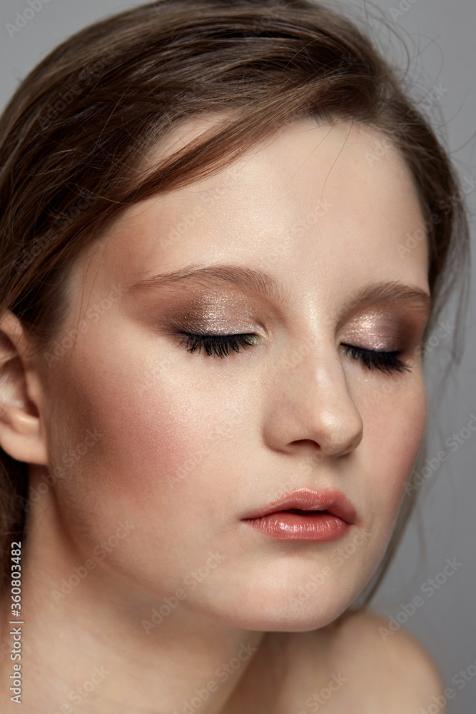 Cute everyday make-up in a young brunette girl. Eyes closed. Cute everyday make-up in a young brunette girl. Eyes closed.