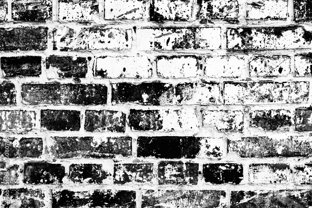 Obraz premium Texture of a brick wall with cracks and scratches which can be used as a background