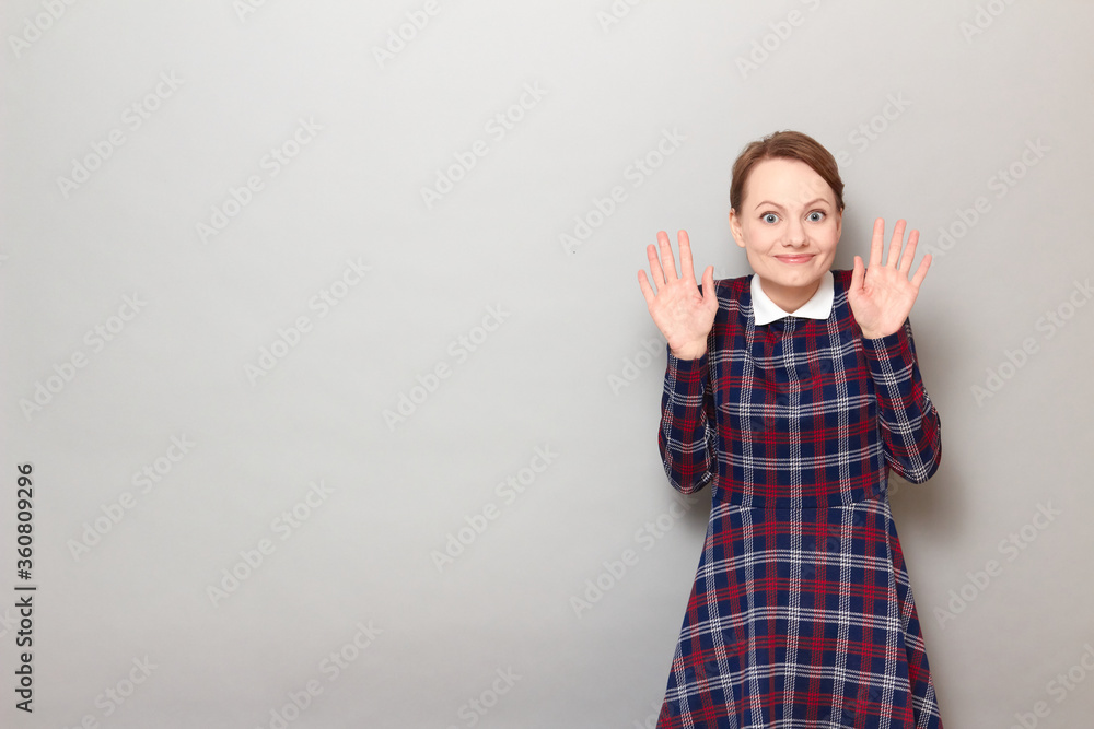 Portrait of happy overjoyed girl raising hands up in triumph Portrait of happy overjoyed girl raising hands up in triumph