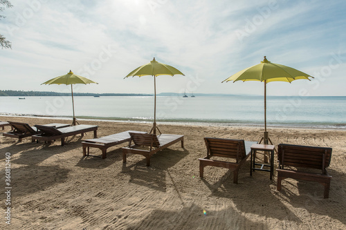 yellow beach umbrella and sunbed, Koh Mak beach, Koh Mak Island , Thailand. © MuratTegmen