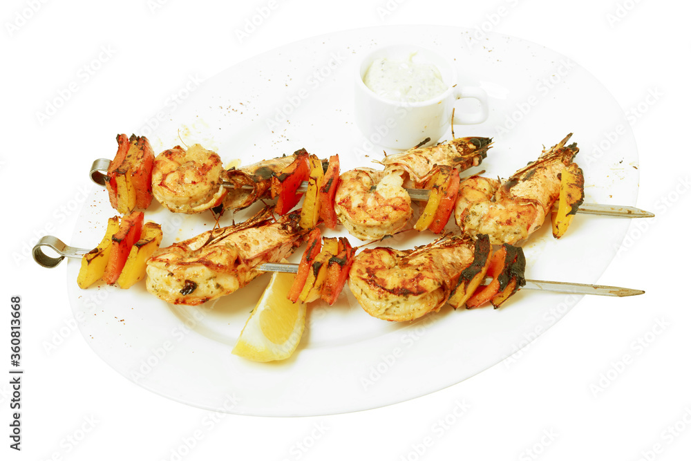 Grilled shrimp and pepper on metal skewers. Grilled shrimp and pepper on metal skewers.