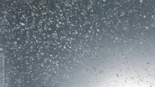 air bubbles float in liquid with colour light.