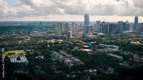 Downtown Austin Texas skyline and lake aerial view from Zilker park with Barton Springs condos on sunny day with beautiful clouds photo