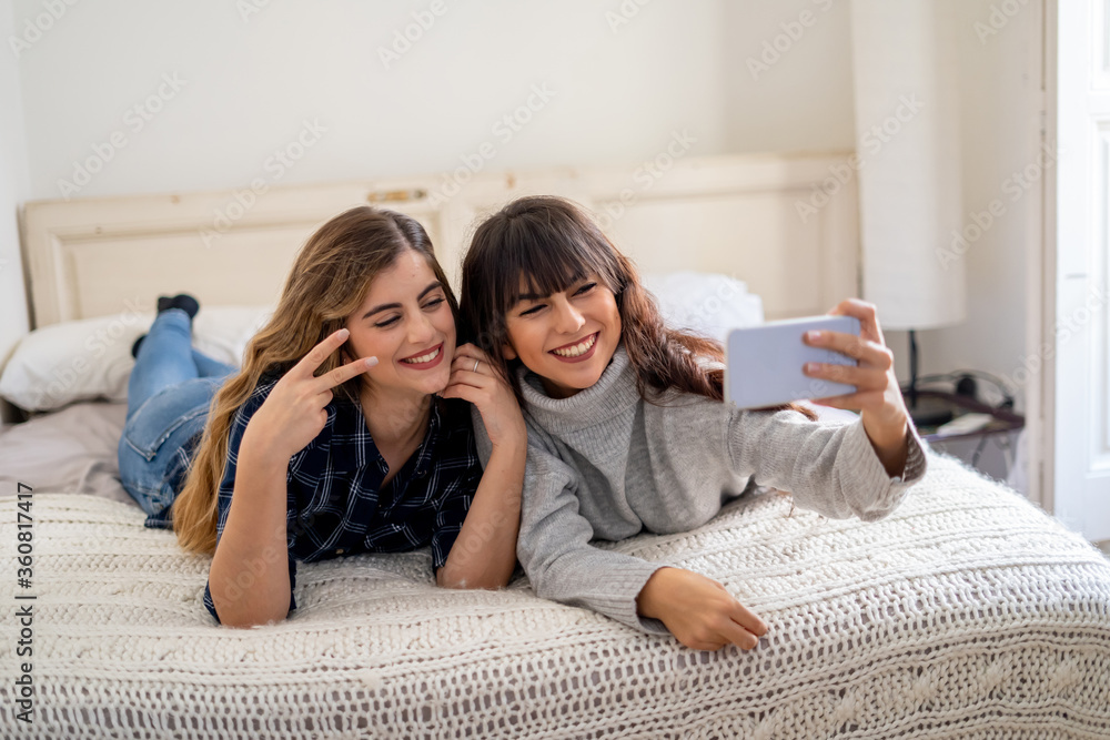 COVID-19 Stay home stay connected. Girlfriends video calling friends or family during lockdown