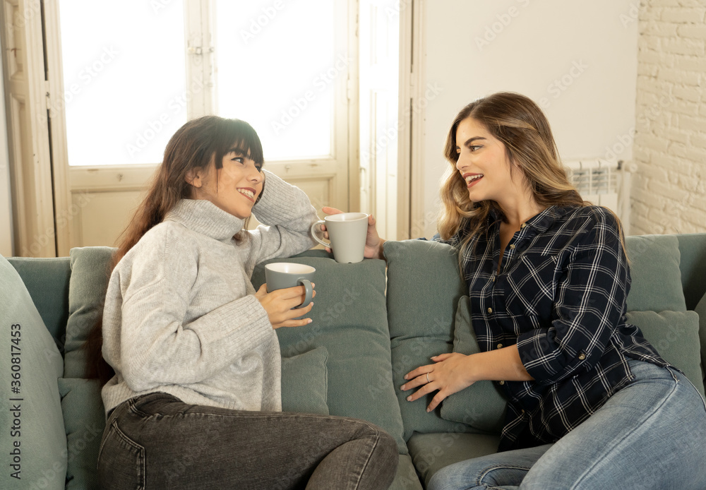 COVID-19 Lockdown. Portrait of confident and optimistic women girlfriends having coffee at home COVID-19 Lockdown. Portrait of confident and optimistic women girlfriends having coffee at home