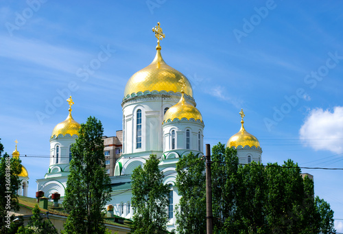 Russian church with gilded domes under the sun