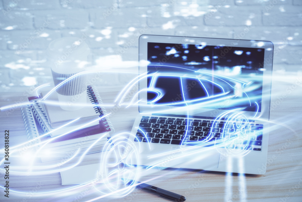 Desktop computer background in office with automobile hologram drawing. Multi exposure. Tech concept. Desktop computer background in office with automobile hologram drawing. Multi exposure. Tech concept.