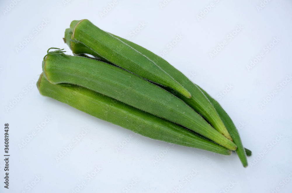 the ripe green ladyfinger isolated on white background. the ripe green ladyfinger isolated on white background.