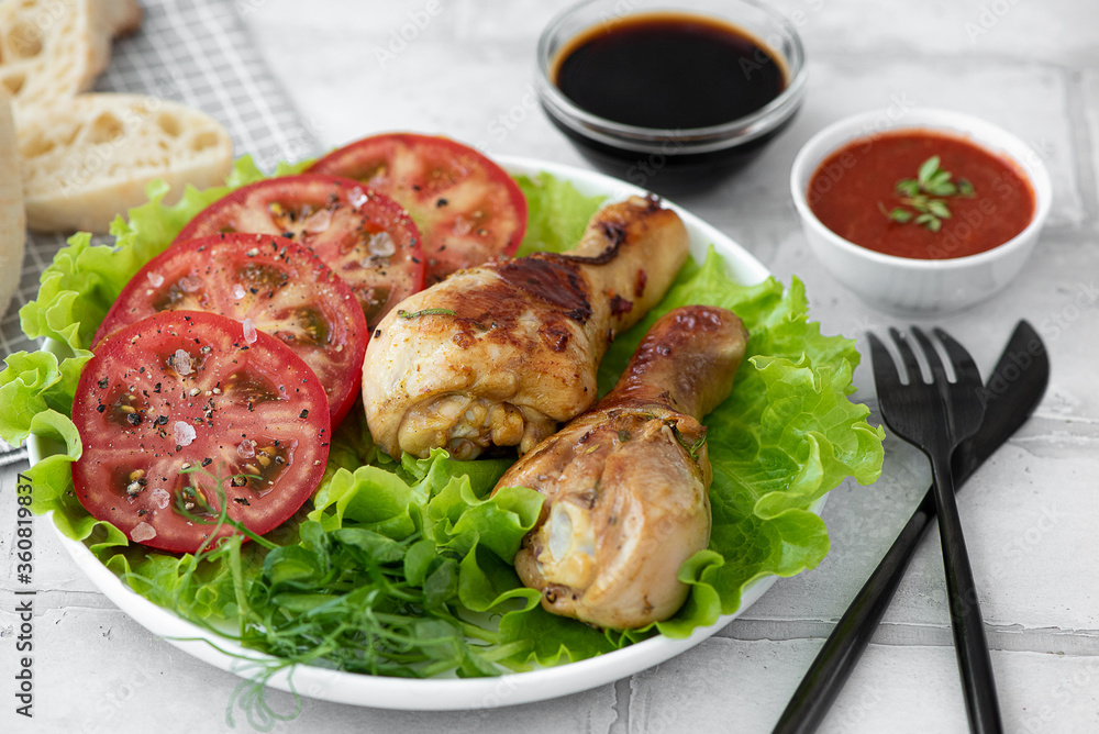crispy fried chicken drumsticks with fresh tomatoes and lettuce crispy fried chicken drumsticks with fresh tomatoes and lettuce