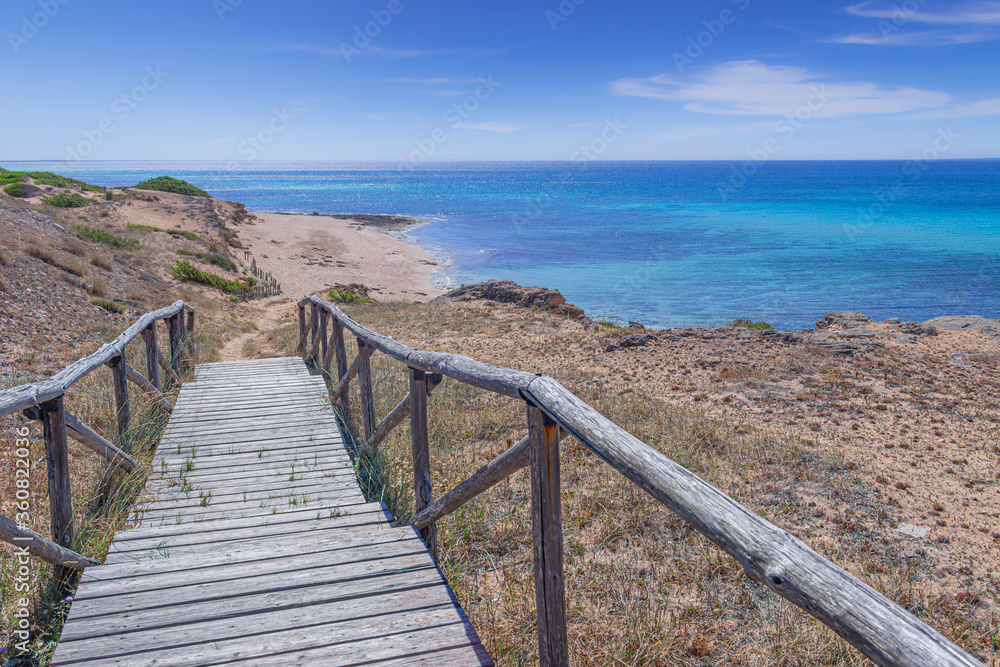 The most beautiful beaches of Italy. Campomarino dune park: fence between sea dunes,Taranto (Apulia). The protected area extends along the entire coast of the town of Maruggio.