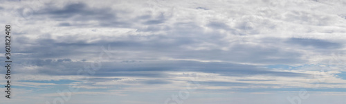 Fototapeta Naklejka Na Ścianę i Meble -  Panorama of blue sky with dense white and gray clouds