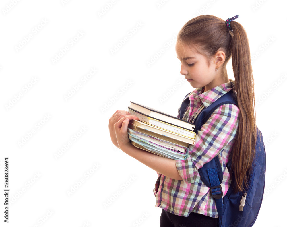 Schoolgirl with books at white isolated background Schoolgirl with books at white isolated background