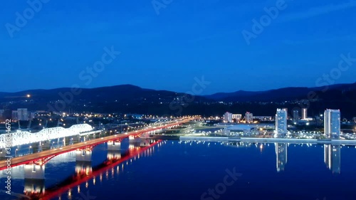 The evening lights of the city Krasnoyarsk. Nikolayevsky bridge photo