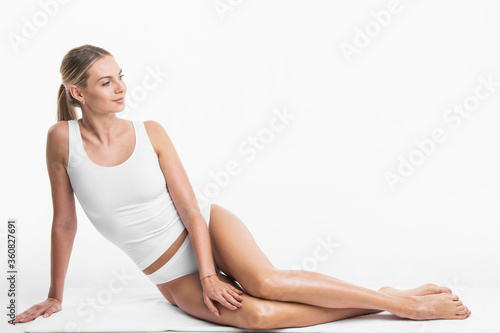 Woman sitting in white underwear