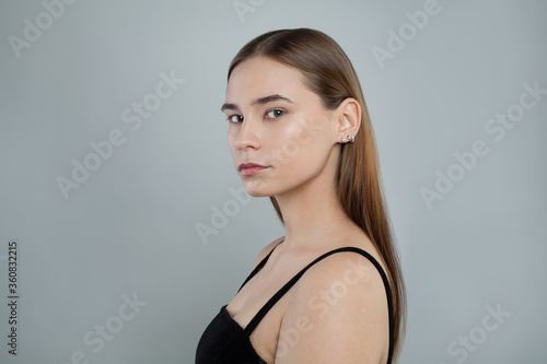 Beautiful young woman without makeup on white background, natural beauty. Skincare and facial treatment concept