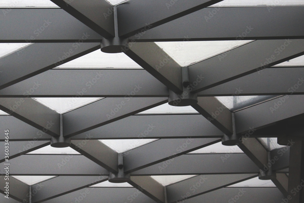 Black and white-gray abstract image of the ceiling of a building. Architecture. Abstraction, background, texture, substrate. Black and white-gray abstract image of the ceiling of a building. Architecture. Abstraction, background, texture, substrate.