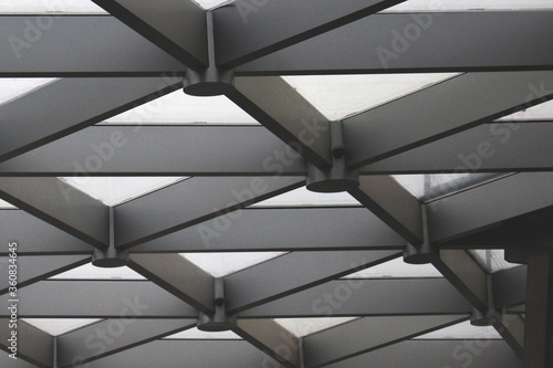 Black and white-gray abstract image of the ceiling of a building. Architecture. Abstraction, background, texture, substrate.