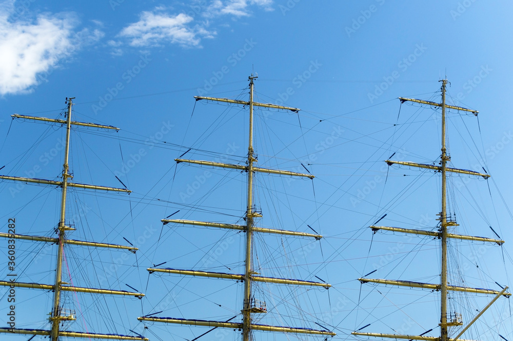 Masts and rigging of a sailing ship against sky Masts and rigging of a sailing ship against sky