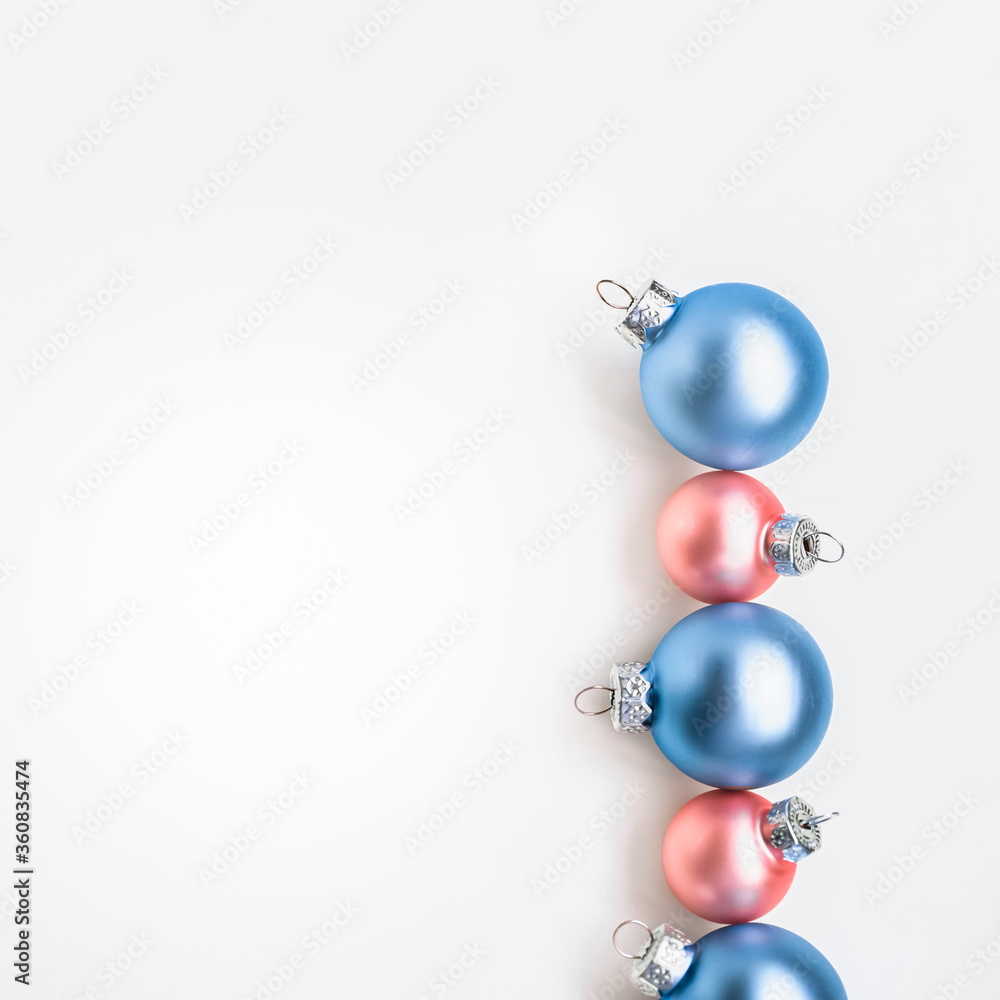 Blue and rose Christmas ornaments on white background with copy space Blue and rose Christmas ornaments on white background with copy space