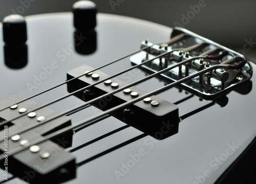 A close-up of an bass electric guitar.