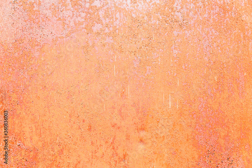 Rusty surface of a pink sheet of iron. Background. Space for text.