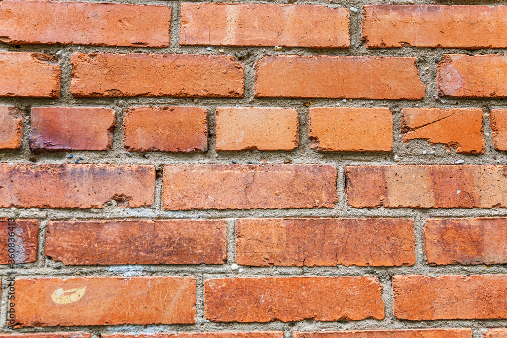 The surface of an old brown brick wall. Texture. Background. Space for text. The surface of an old brown brick wall. Texture. Background. Space for text.