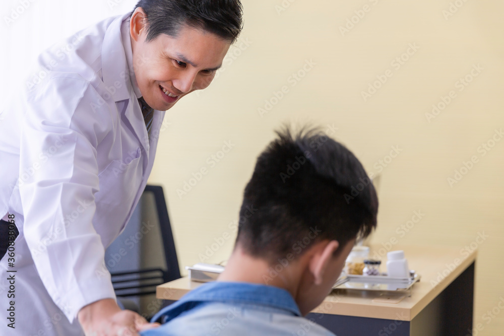 Asian doctor consulting and encourage disability young patient Asian doctor consulting and encourage disability young patient