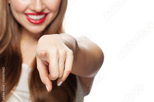 Pointing hand. Female finger points photo