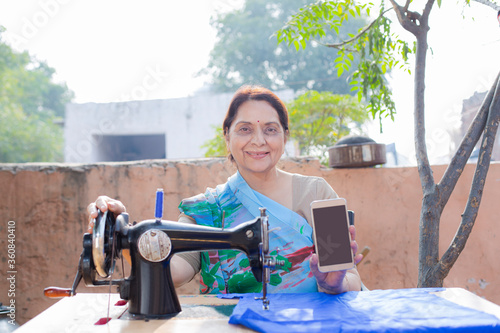 Photography Rural woman showing mobile phone