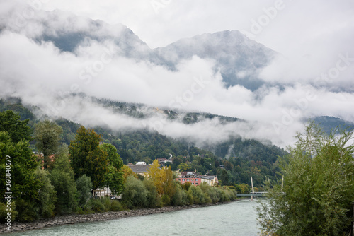 Village in the valley with rivers flowing and covered with clouds.