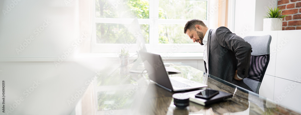 Man With Back Pain Stress At Computer Man With Back Pain Stress At Computer