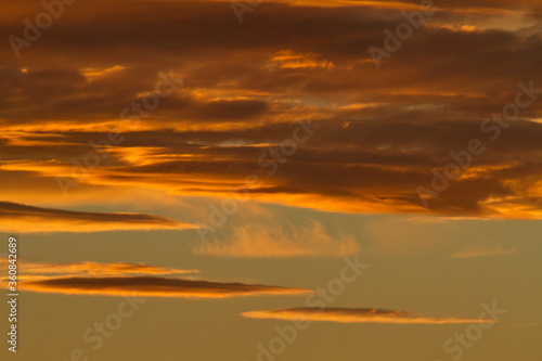 Colorful cloud patterns with golden hour light. © Iskander Barrena