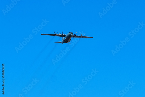 SAINT-PETERSBURG, RUSSIA - APRIL 30, 2019: Russia air force freighter plane Antonov An-12 in flight. photo