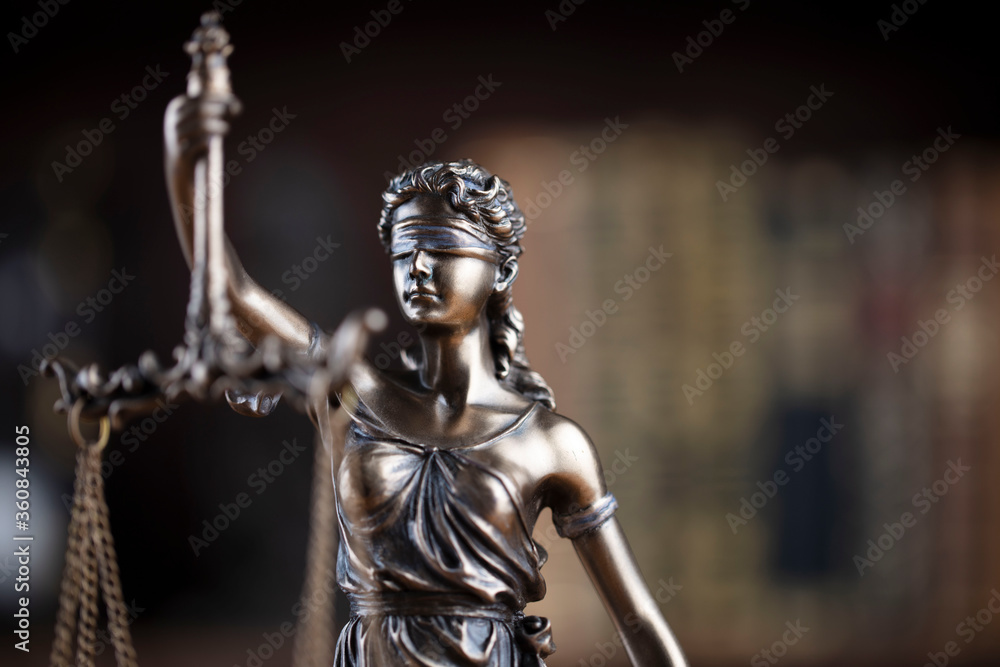 Justice concept. Themis statue in jugde office.