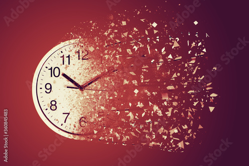 Time Management Concept : White wall clock break down and dispersion to particle. photo