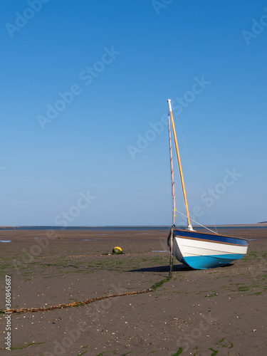 Beached boat, far from sea. Tide out, Bristol Channel tidal reach. Instow. photo